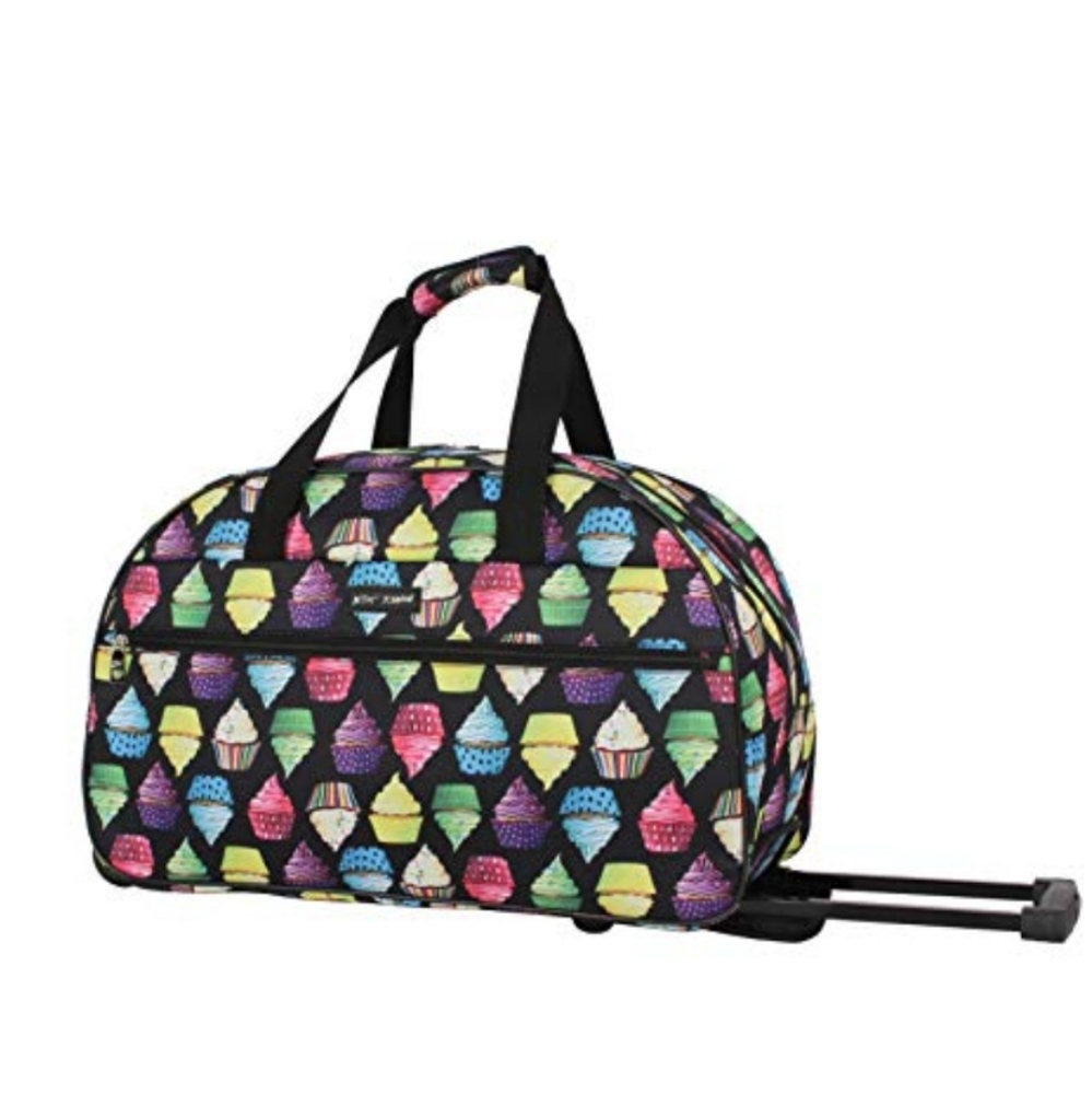 Betsey Johnson CUPCAKE Rolling Duffle Luggage. Like new. Used a couple of times